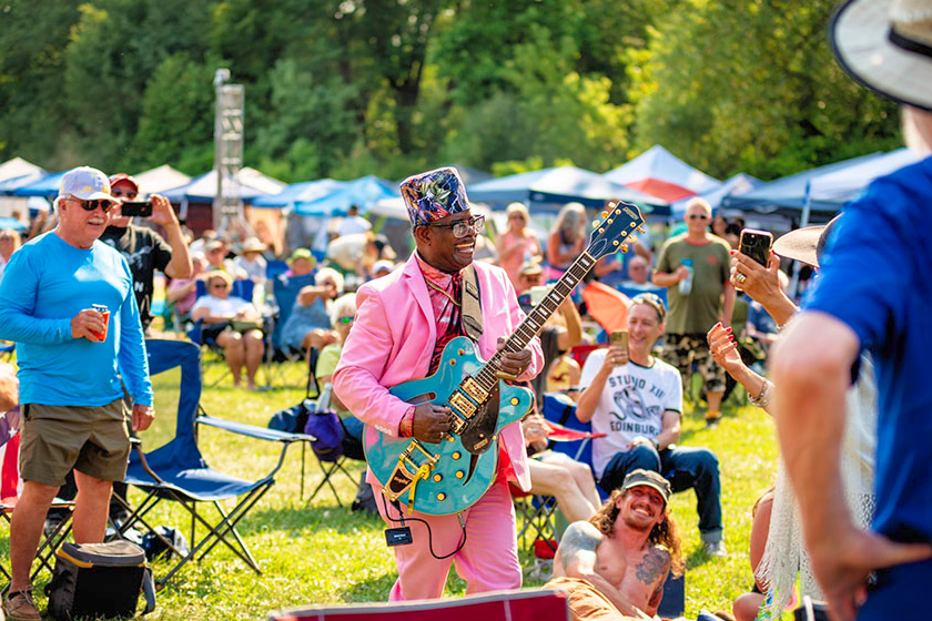 guitarist performing in the crowd